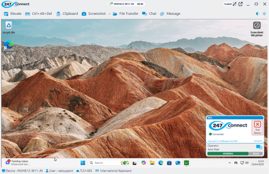 View window displaying the desktop of the remote computer INVH612-W11-JN. The desktop background features a landscape of colourful, layered mountains. The toolbar at the top of the window includes options like Elevate, Ctrl+Alt+Del, Clipboard, Screenshot, File Transfer, Chat and Message. A session timer shows 00:40 elapsed. At the bottom right, a session panel indicates the session is active, the operator is Jane Neal, and the status is VIEWING. System tray icons and the date and time are visible.
